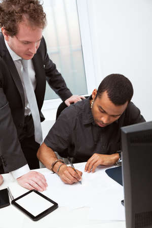 Business partners working in the office. Signing the contractの写真素材