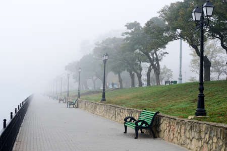 An empty bench in the lakeの写真素材