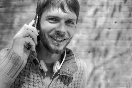 Man talking on the phone, red background