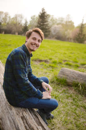 Handsome guy resting in the parkの写真素材