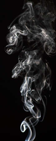 Smoke of different colors with studio lightの写真素材