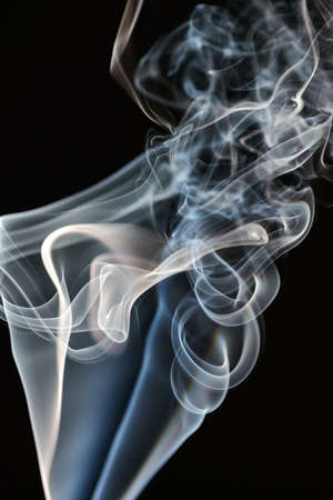 Smoke of different colors with studio lightの写真素材