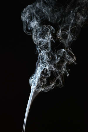 Smoke of different colors with studio lightの写真素材