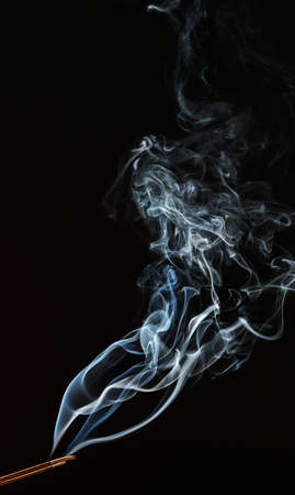 Smoke of different colors with studio lightの写真素材