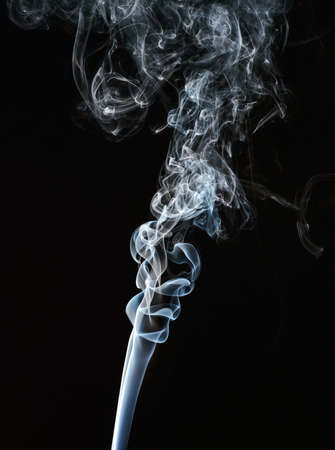 Smoke of different colors with studio lightの写真素材
