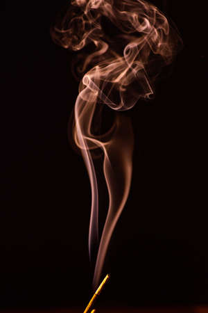Smoke of different colors with studio lightの写真素材