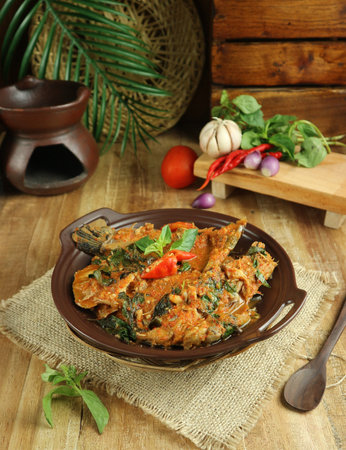 Indonesian food Spicy fish curry on wood background. Indonesian foodの写真素材