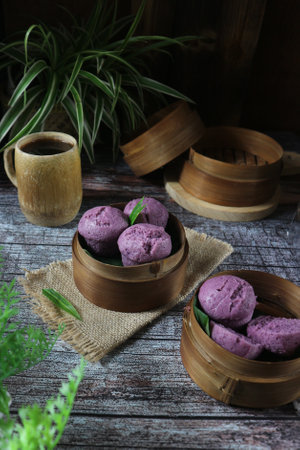 Indonesian steamed dumpling in bamboo steamer on wooden background