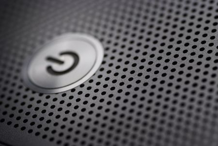 power button from a silver laptopの写真素材