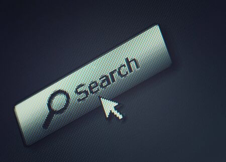 Close-up of a interface computer search button and an arrow mouse cursorの写真素材