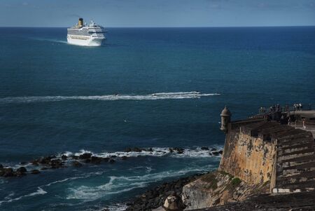 Luxury white cruise ship shot at high angle level on a clear day with calm seas and blue skyの写真素材