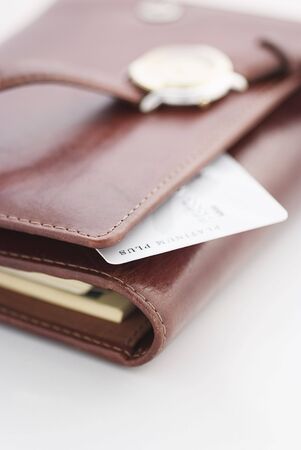 credit card and a watch on a agenda,business backgroundの写真素材
