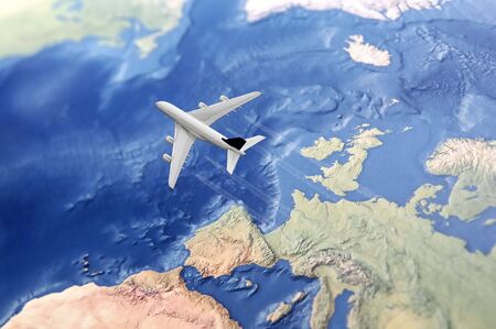 White Civil Airplane over the Atlantic ocean flying from Europe to the USAの写真素材