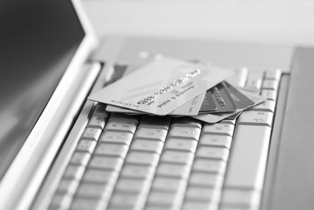 Credit cards on a laptop keyboard の写真素材
