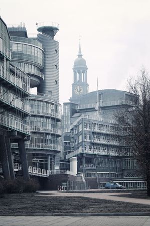 View to Hamburg and St Michael church from the harbor in a foggy morningの写真素材