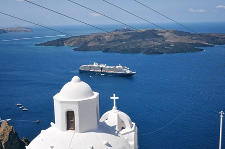 Panoramic view from Santorini with church dome and cruise shipの写真素材
