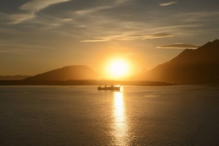Fishing boat at sunset in Ushuaia, Argentinaの写真素材