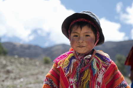 Portrait of a Peruvian boy dressed in colourful traditional handmade outfit. October 21, 2012 - Patachancha, Cuzco, Peruのeditorial素材
