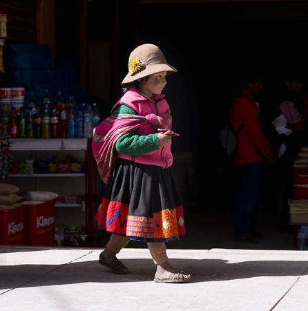 Peruvian girl dressed in colourful traditional handmade outfit. October 19, 2012 - Ollantaytambo, Peruのeditorial素材