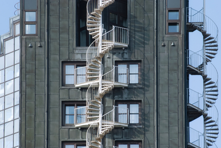 Emergency fire escape staircases on a building exterior. Urban architecture in Hamburg, Germanyの写真素材