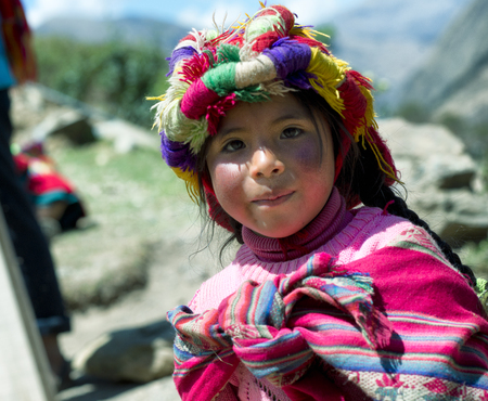 Portrait of a Peruvian girl dressed in colourful traditional handmade outfit. October 21, 2012 - Patachancha, Cuzco, Peruのeditorial素材