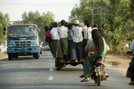 Overcrowded pickup truck on a highway in Yangon.  February 23, 2014 - Rangoon, Myanmarのeditorial素材