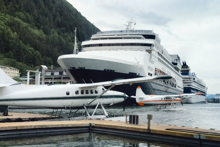 Seaplanes and cruise ships at the busy port of Juneau, Alaska