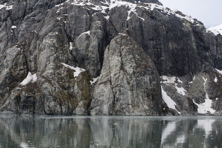 Steep Glacially Polished Cliffs at Glacier Bay, Alaskaの写真素材