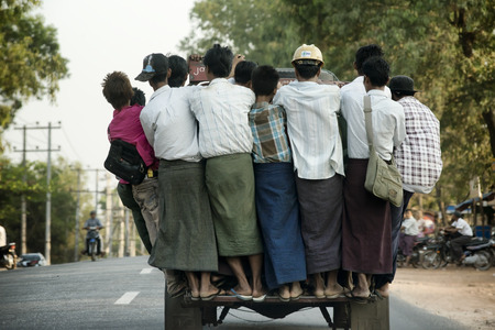 Overcrowded pickup truck on a highway in Yangon.  February 23, 2014 - Rangoon, Myanmarのeditorial素材