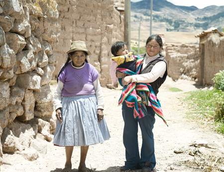 Quechua family - three generations of native Peruvian women. October 18, 2012 - Maras, Urubamba Valley, Peruのeditorial素材