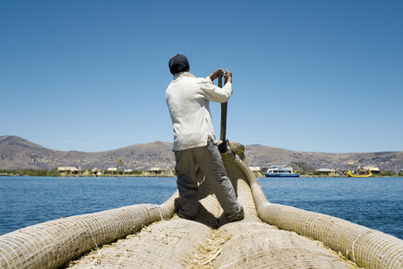 Reed Boatman of Lake Titicaca, Uros Islands, Peruのeditorial素材