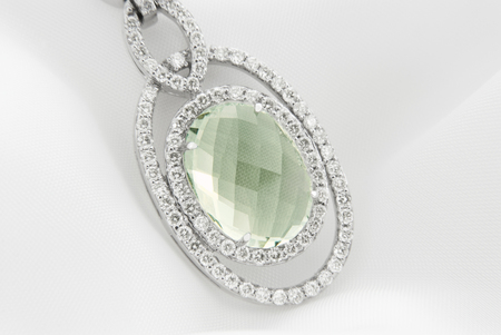 White Gold Pendant With Green Amethyst And Diamonds On Soft White Backgroundの写真素材