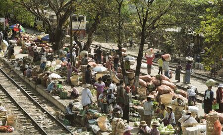 Busy Fruit And Vegetable Market On The Station Platform And Along The Rail Track. February 22, 2014 - Danyingon Railway Station, Yangon, Myanmarのeditorial素材