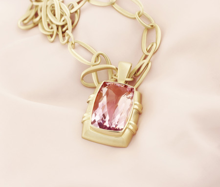 Yellow Gold Pendant With Amethyst On Soft Backgroundの写真素材