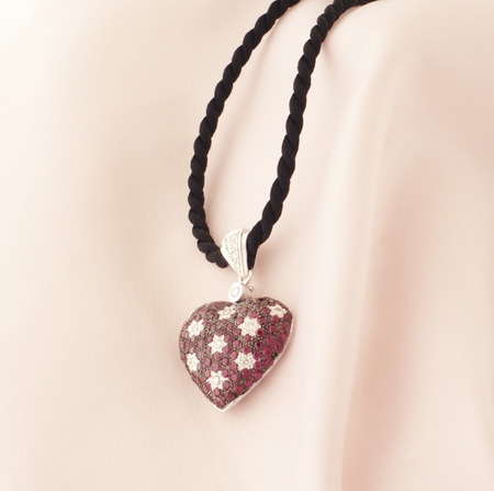 White Gold Heart Shaped Pendant With Rubies And Diamondsの写真素材