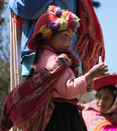 Patachancha, Cuzco, Peru - October 21, 2012: Close up Of  A Peruvian Girl Dressed In Colorful Traditional Handmade Outfitのeditorial素材