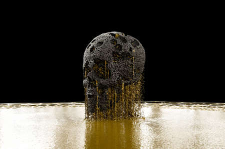 Gold Melting Out Of Carved Skullの写真素材