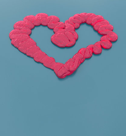 A Delicate Pink Liquid Heart Candy on Light Blue Backgroundの写真素材