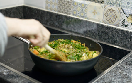 A fresh homemade green bean stew with carrots and potatoes, garnished with parsley.の写真素材
