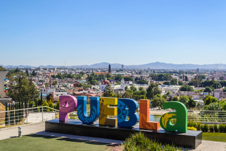 PUEBLA, MEXICO - March 9, 2022: Colorful Sign for Puebla overlooking the city from Los Fuertes on March 9, 2022 in Puebla, Mexicoのeditorial素材