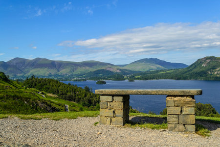 A bench overlooking Derwent Water in the Lake District National Parkの写真素材