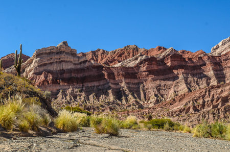 Unique smooth and rounded red sandstone formations at the Cuevas de Acsibi between Cachi and Cafayate, Argentinaの写真素材