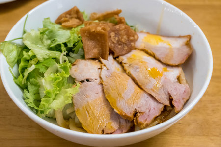 Cao lau is a regional Vietnamese dish made with noodles, pork, and local greens in Hoi An