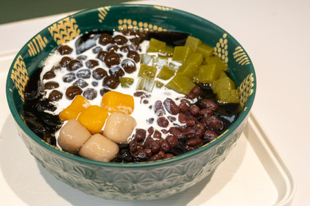 Taiwanese dessert of grass jelly with taro balls, red beans, tea jelly and creamの写真素材