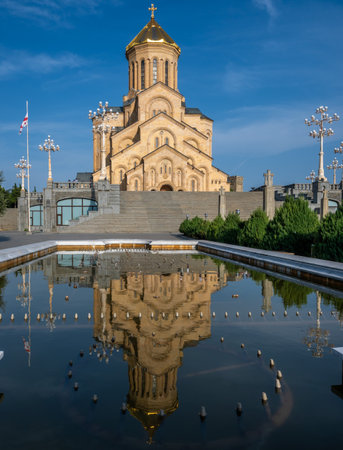 Holy Trinity Cathedral of Tbilisi also know as Sameba Cathedral reflecting in still water. A symbol...