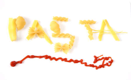 Word pasta created from assortment of pasta underlined with ketchup on white backgroundの写真素材