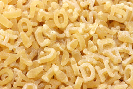 Close up of raw pasta alphabet scatteredの写真素材