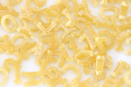 Close up of raw pasta alphabet scatteredの写真素材