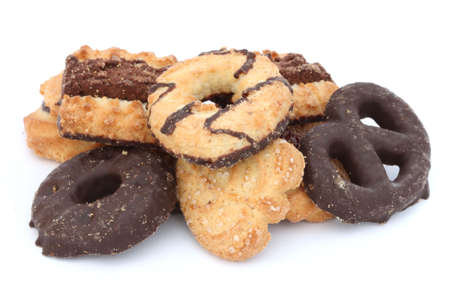 Heap of assortement of shortbread butter biscuits with chocollate on whiteの写真素材