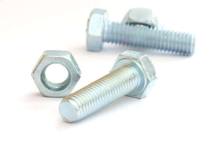 Few screw bolts close up on white background